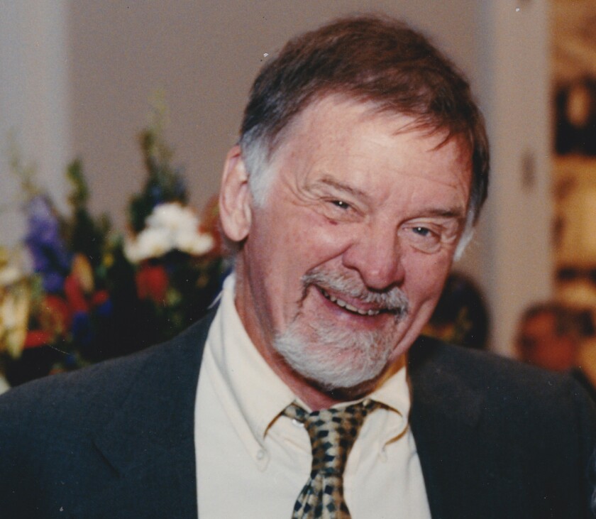 Gary B. Nash smiles in a suit and tie