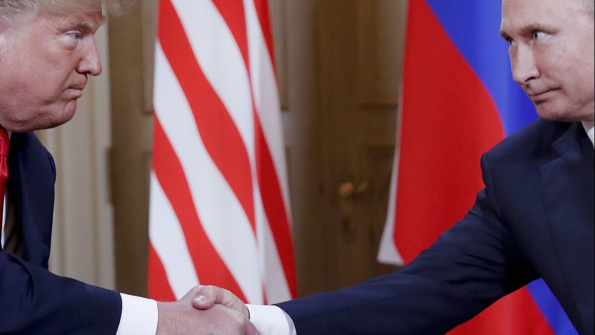 President Trump and Russian President Vladimir Putin shake hands in Helsinki, Finland on July 16.