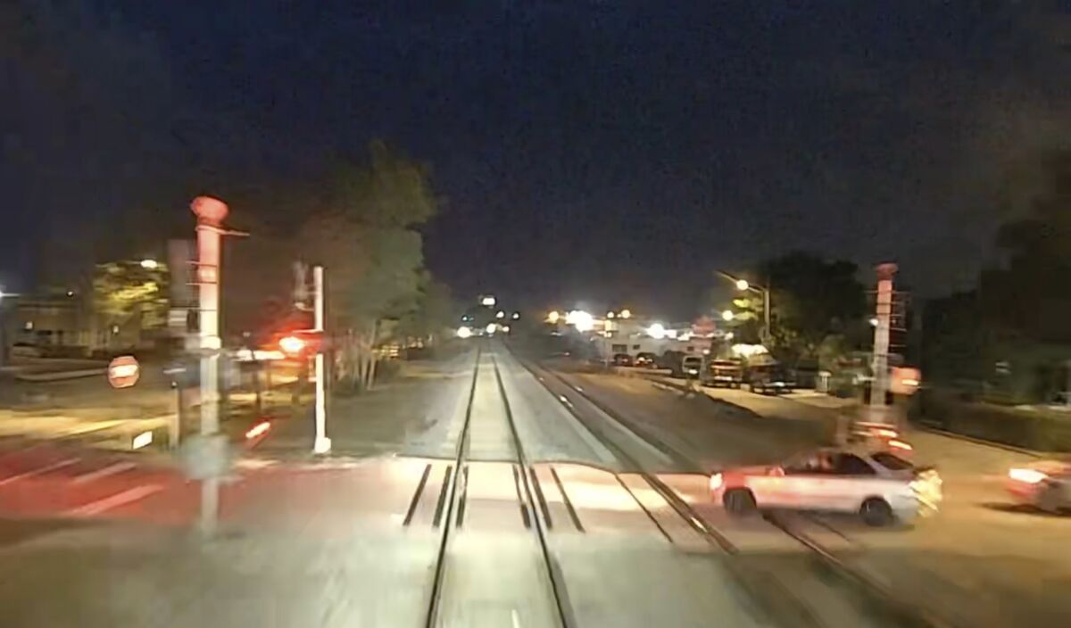 This image from a camera inside the nosecone of a train provided by Brightline Trains shows a car about to cross its path in Lake Worth, Fla., Wednesday, Feb. 16, 2022. Brightline trains killed one person and seriously injured another in separate accidents less than 12 hours apart, the latest in a spate of collisions plaguing the higher-speed passenger trains since the railroad recently resumed operations. A Brightline statement said it released Wednesday's video as “an example of the dangers of disobeying rail crossings (and) to educate motorists and pedestrians in an effort to prevent future trespassing.” (Brightline Trains via AP)