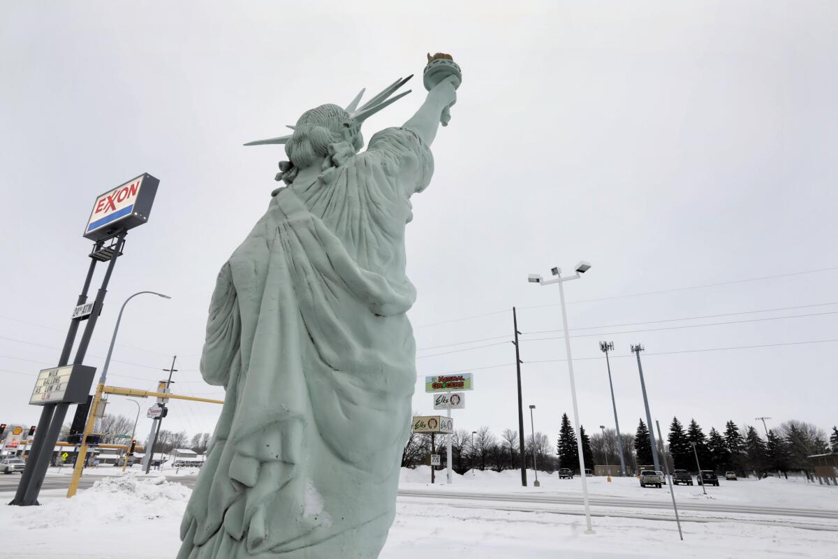 A faux Statue of Liberty advertises a tax preparation business in Bismarck, N.D. 