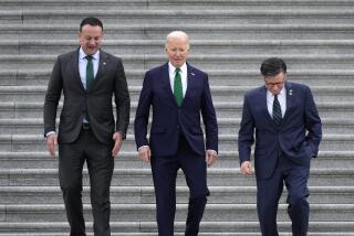 From left, Irish Prime Minster Leo Varadkar, President Joe Biden, and Speaker of the House Mike Johnson, R-La., walk down the steps following the annual St. Patrick's Day gathering at the Capitol in Washington, Friday, March 15, 2024. (AP Photo/J. Scott Applewhite)