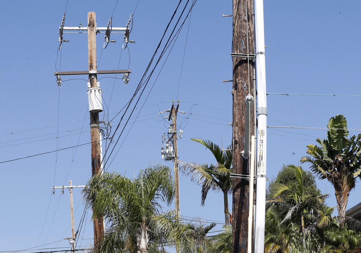 Power poles line Glenneyre Street in the neighborhood of Woods Cove in Laguna Beach.