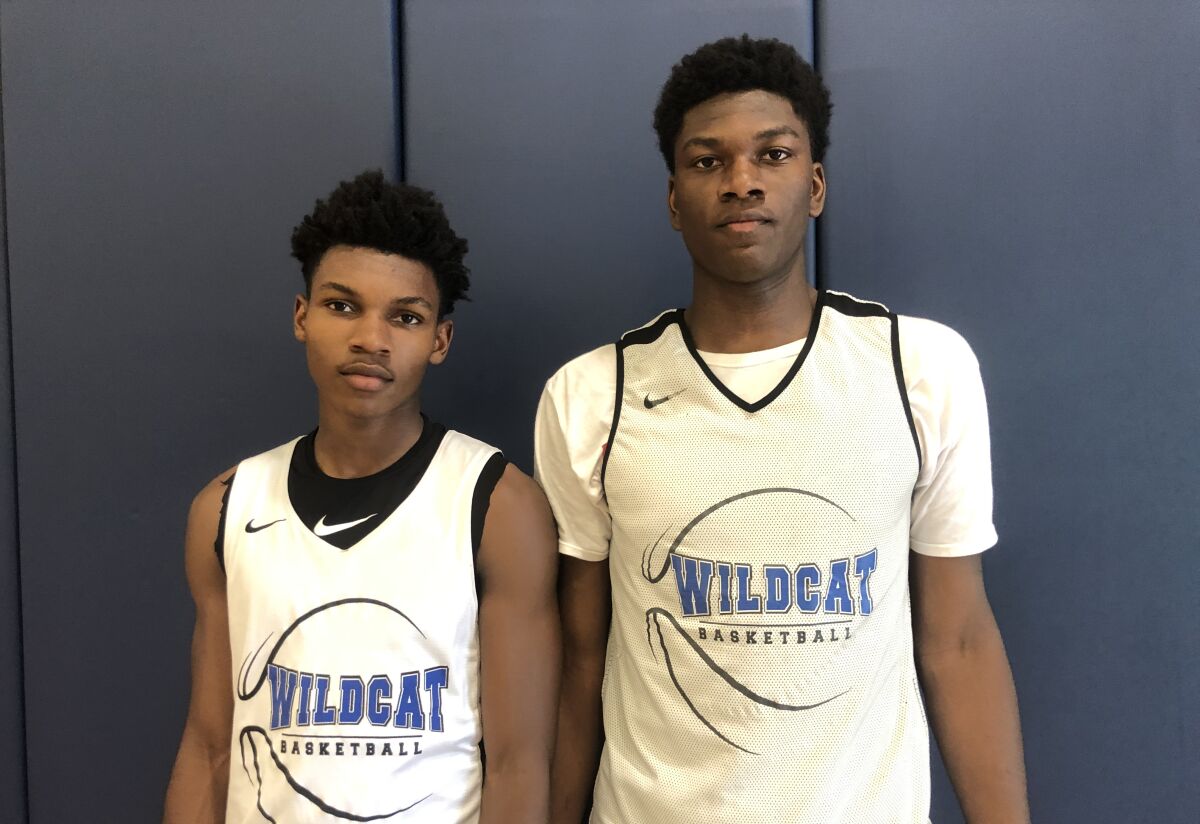 Sophomore point guard Dylan Andrews, left, and sophomore big man Kijani Wright figure to lead Windward to basketball prominence before they graduate.