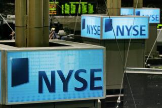 FILE - In this Sept. 17, 2007 file photo, New York Stock Exchange signs top trading posts on the floor of the NYSE. Rising loan losses at JPMorgan Chase & Co.'s consumer bank and a disappointing reading on consumer sentiment sent investors rushing from stocks Friday, Jan. 15, 2010.(AP Photo/Richard Drew, file)