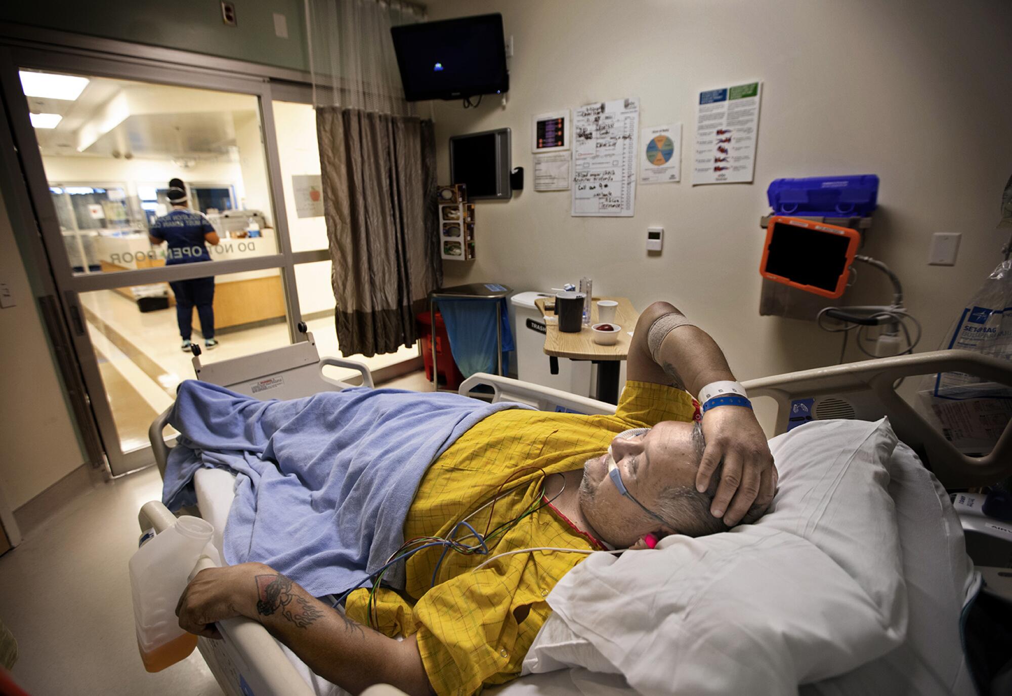 Mariano Zuñiga Anaya, 57, on a hospital bed