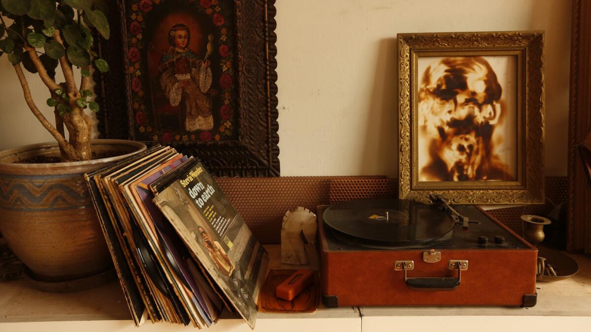 Vinyl albums and an old record player inside Lopez's loft.