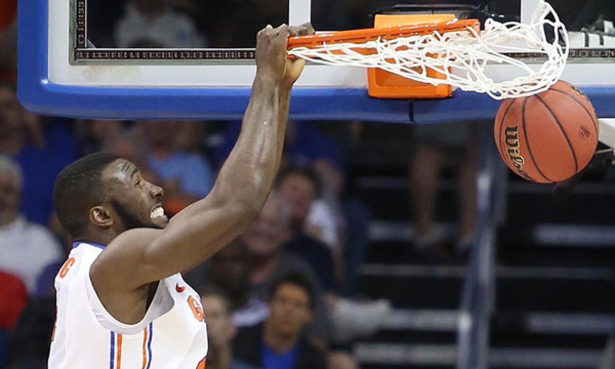Florida's Patric Young dunks during Florida's 67-55 win over Albany in the second round of the NCAA tournament on Thursday.