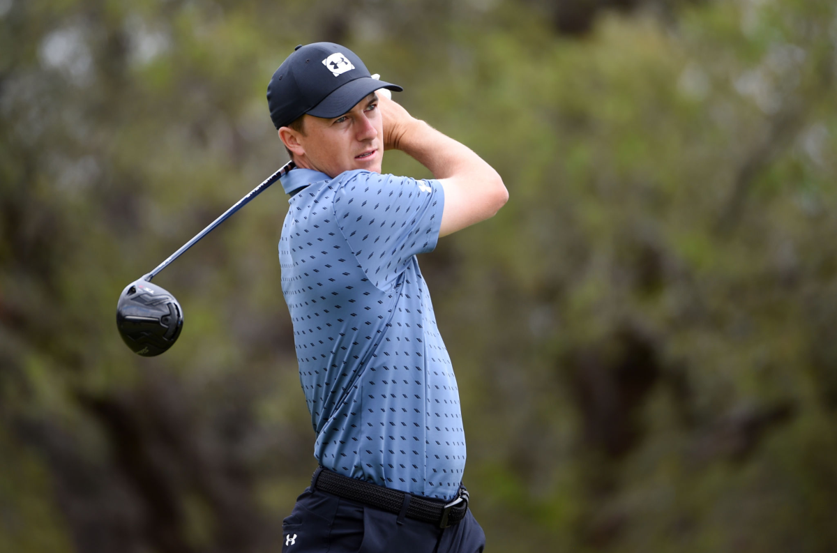 Jordan Spieth hits off the second tee during the final round of Valero Texas Open on Sunday.
