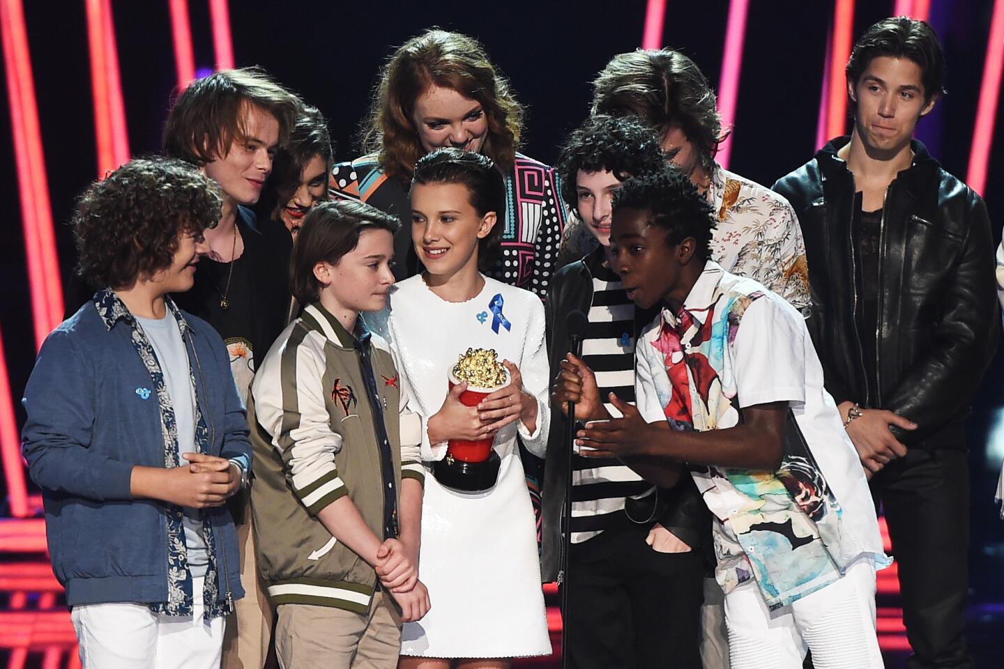 The cast of "Stranger Things" accepts Show of the Year award during the 2017 MTV Movie & TV Awards at the Shrine Auditorium in Los Angeles.