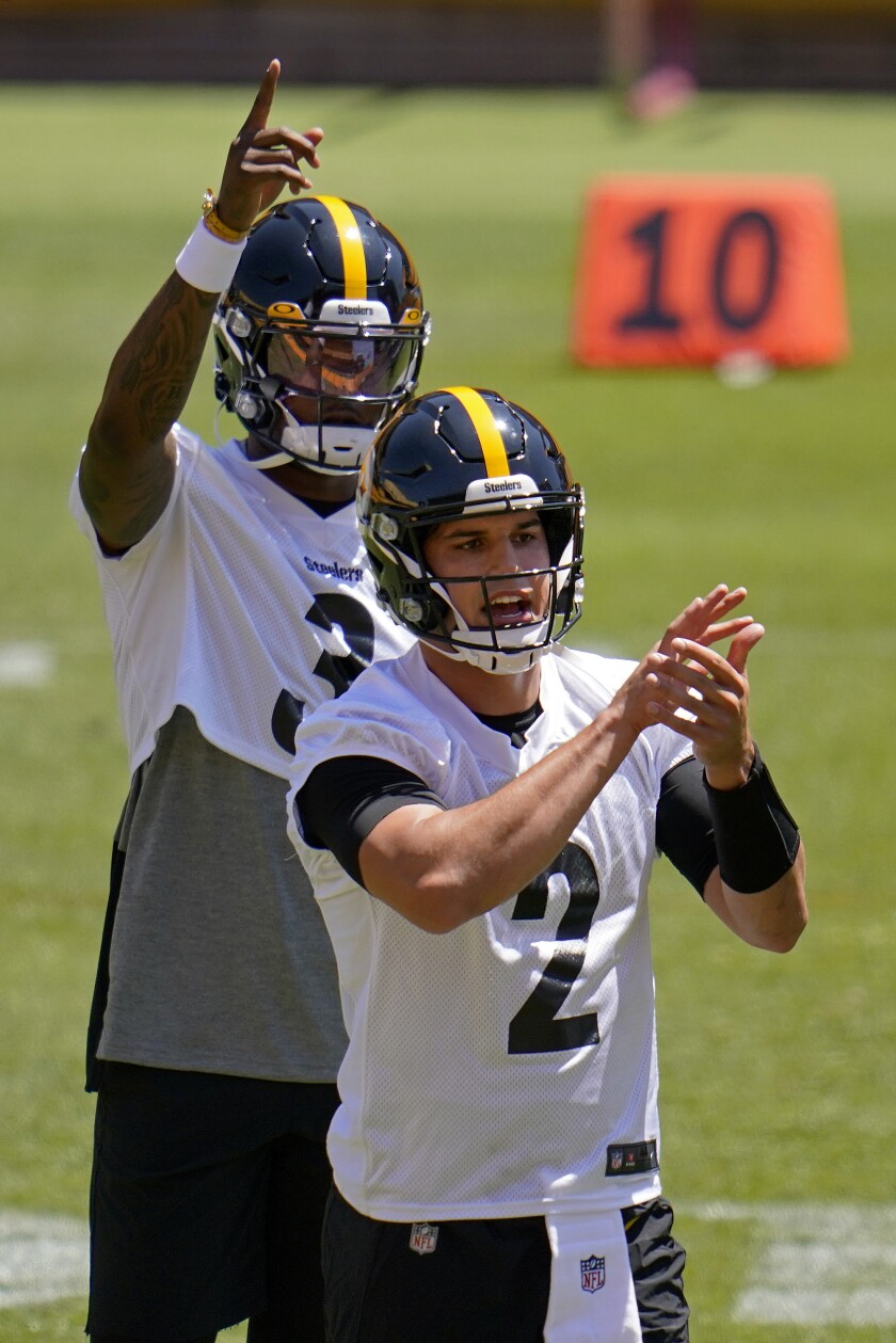 Pittsburgh Steelers quarterbacks Dwayne Haskins (3) and Mason Rudolph work during the team's NFL minicamp football practice in Pittsburgh, Thursday, June 17, 2021. (AP Photo/Gene J. Puskar)