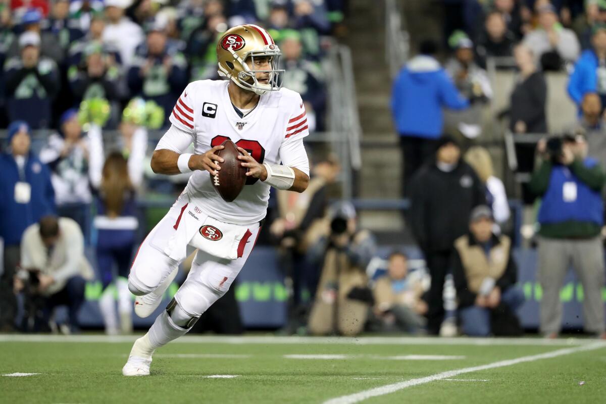 San Francisco 49ers quarterback Jimmy Garoppolo looks to pass against the Seattle Seahawks on Sunday.