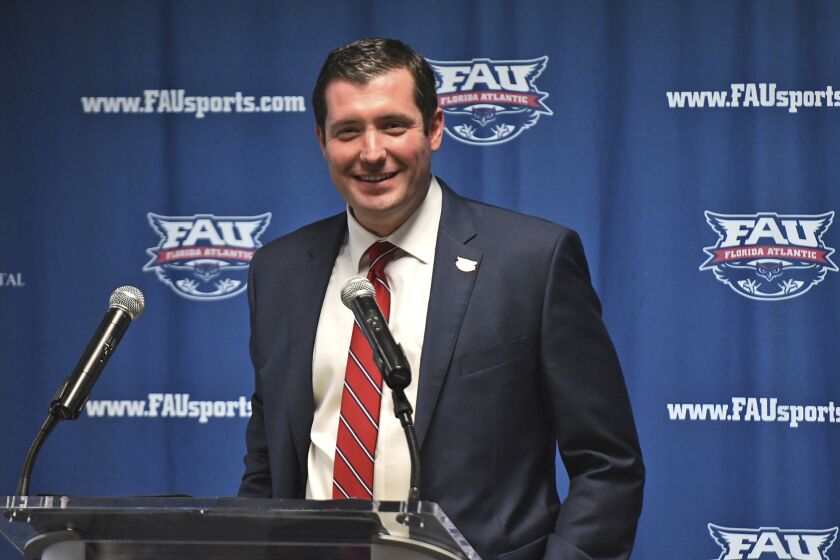 FILE -Brian White, Florida Atlantic's new athletic director, smiles as he is introduced during a news conference, Wednesday, March 14, 2018, in Boca Raton, Fla. Brothers and fellow athletic directors Danny (UT) and Brian White (FAU) meet on Thursday, March 23, 2023 in a Sweet 16 matchup.(Jim Rassol/South Florida Sun-Sentinel via AP, File)