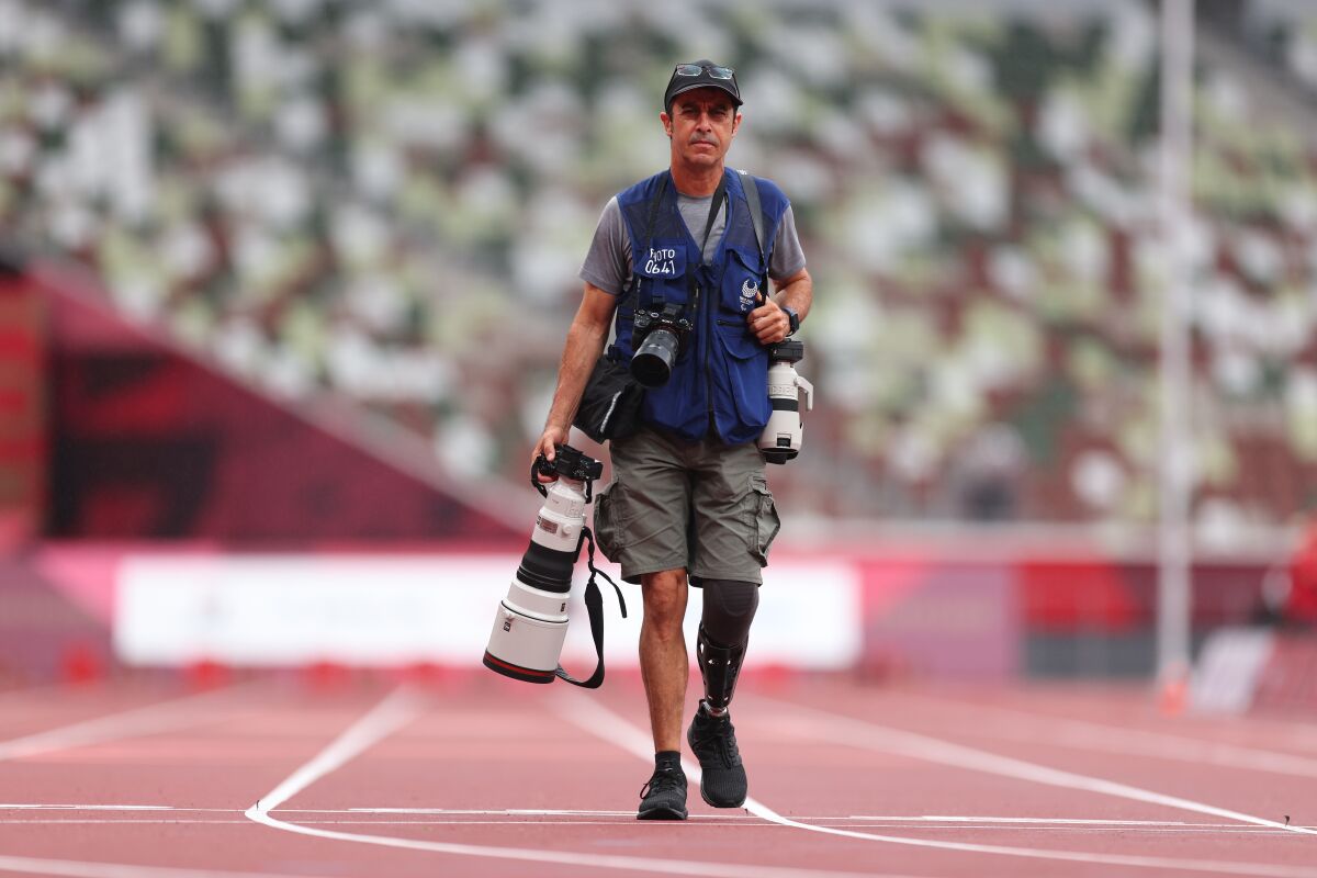 Associated Press Photographer Emilio Morenatti stands for a portrait at the 2020 Tokyo Paralympics, Saturday, Sept. 4, 2021, in Tokyo, Japan. (Marko Djurica via AP)