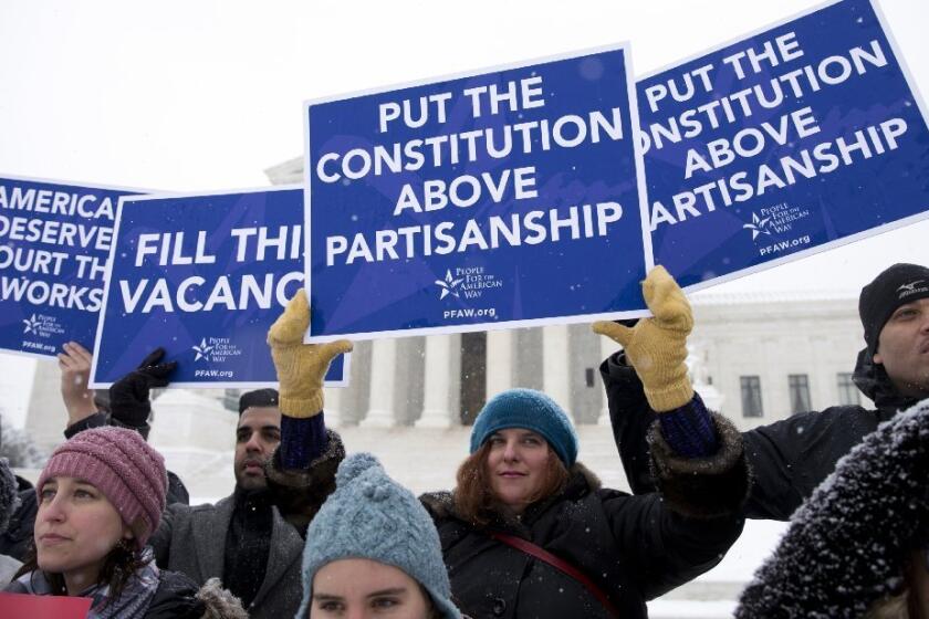 Demonstrators outside the Supreme Court on Monday call for the Senate to act on a nominee to succeed Justice Antonin Scalia.