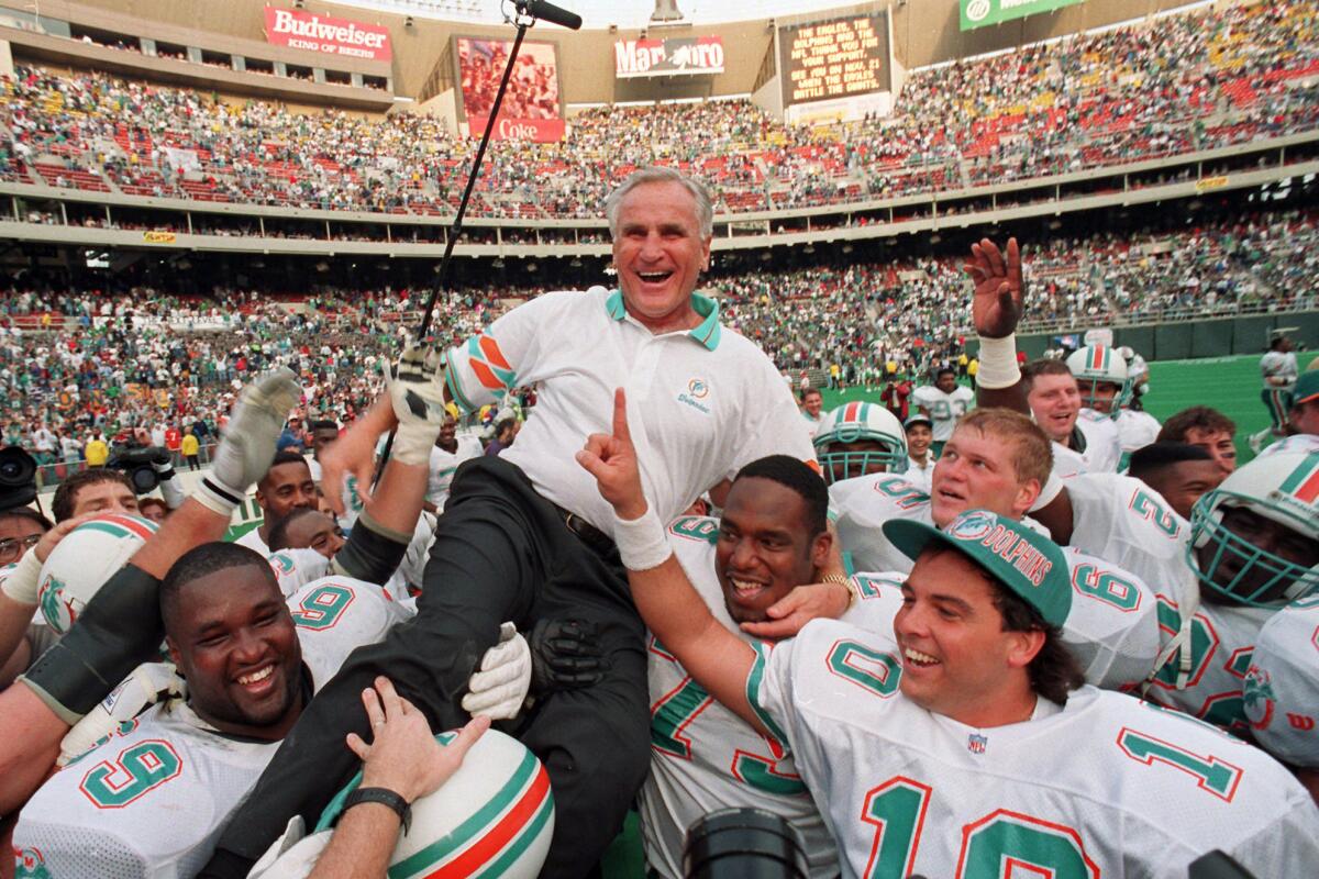 Miami Dolphins coach Don Shula is carried on his team's shoulders after his 325th career coaching victory.