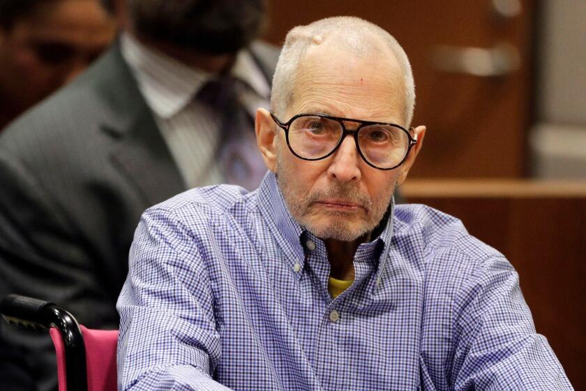 FILE - In this Dec. 21, 2016 file photo, millionaire real estate heir Robert Durst sits in a courtroom in Los Angeles. Prosecutors in the Los Angeles murder case against eccentric New York real estate heir Durst say his victim's words should be used against him in court. A preliminary hearing begins Monday April 16, 2018, to determine if Durst will stand trial for murder in the execution-style shooting of his best friend years ago in Los Angeles. (AP Photo/Jae C. Hong, Pool, File)