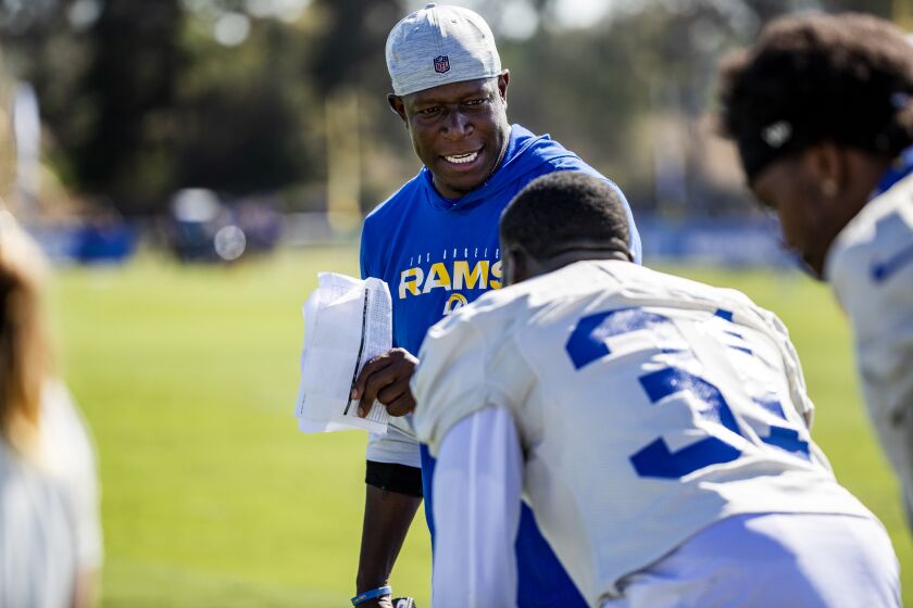 IRVINE, CA - JULY 28, 2021: Rams new Defensive Coordinator Raheem Morris with players on the first day of training camp at UC Irvine on July 28, 2021 in Irvine, California.(Gina Ferazzi / Los Angeles Times)