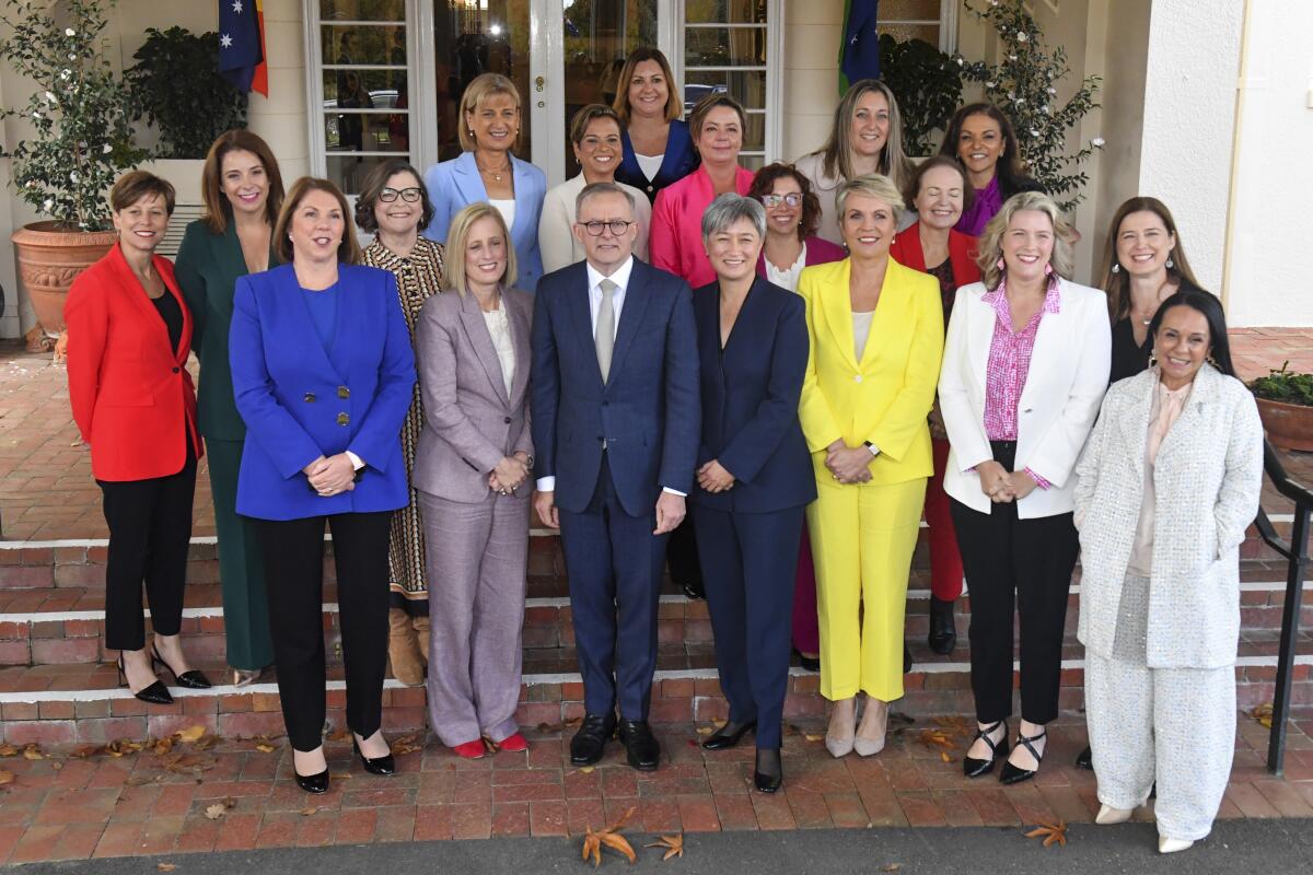 Australian Prime Minister Anthony Albanese surrounded by female government ministers