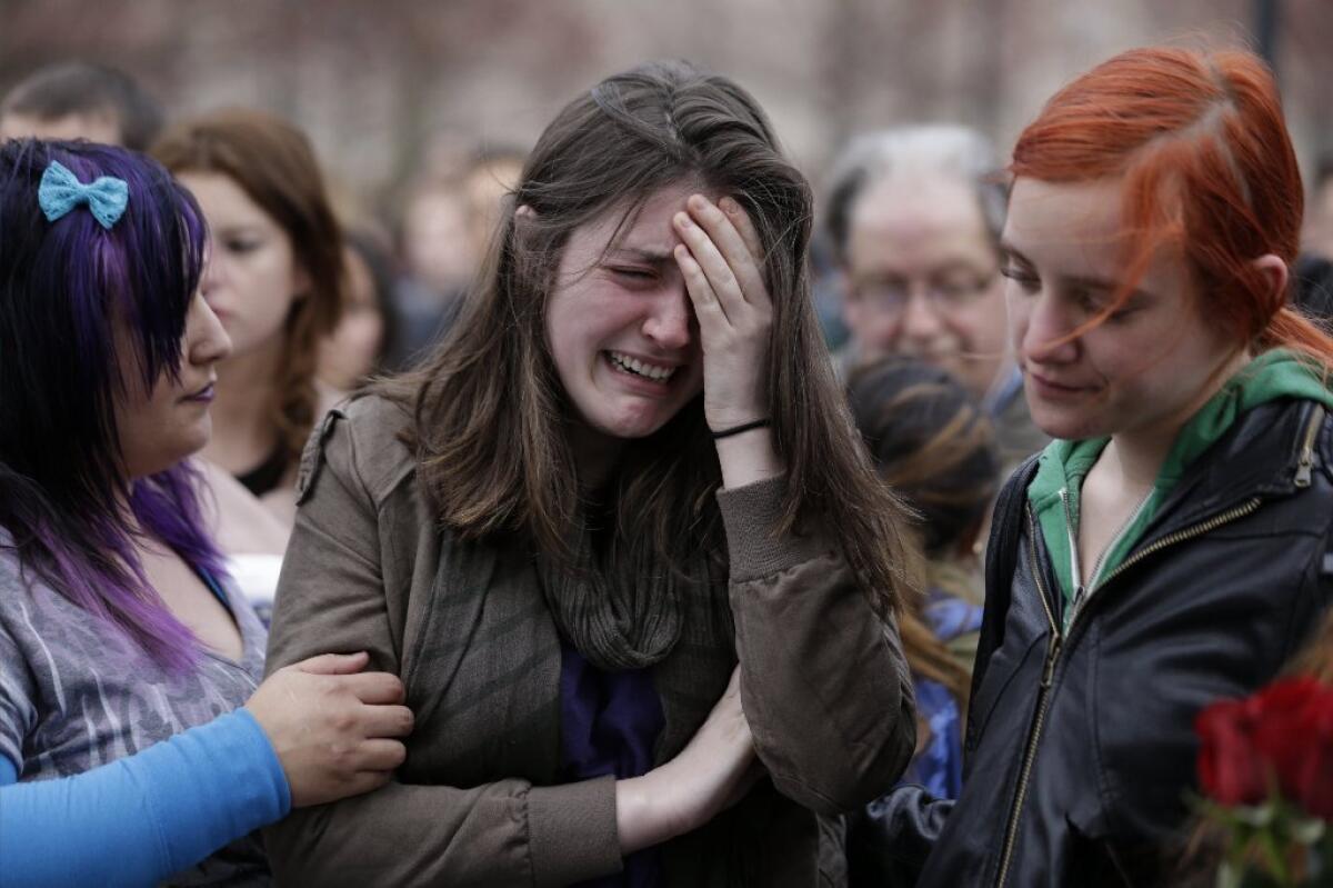Emma MacDonald, 21, cries during a vigil for the victims of the Boston Marathon explosions at Boston Common.