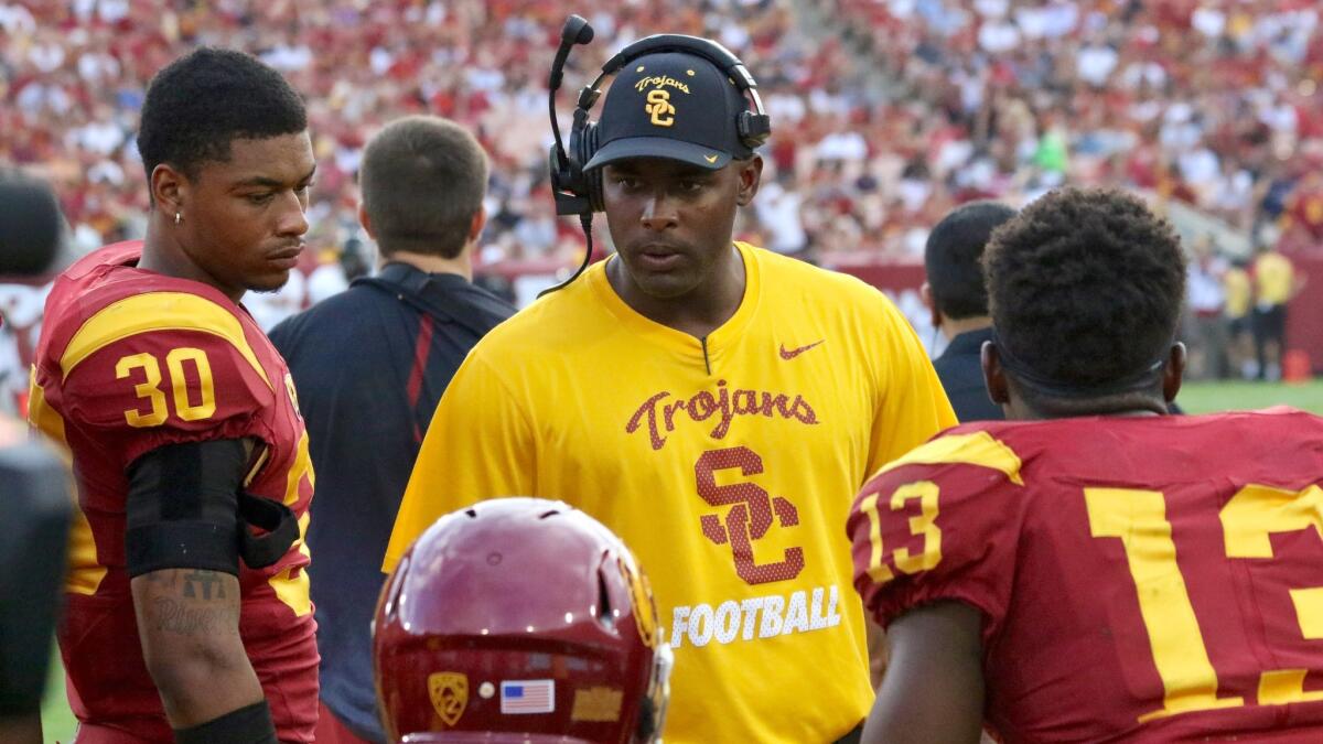 USC defensive backs coach Keith Heyward talks to his players during a game against Idaho earlier this season.