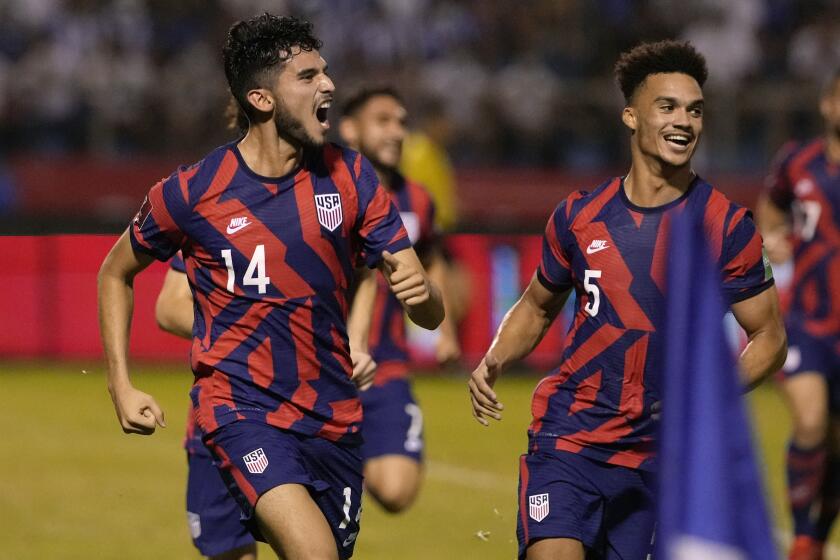 United States' Ricardo Pepi, left, celebrates scoring his side's second goal against Honduras during a qualifying soccer match for the FIFA World Cup Qatar 2022, in San Pedro Sula, Honduras, Wednesday, Sept. 8, 2021. (AP Photo/Moises Castillo)