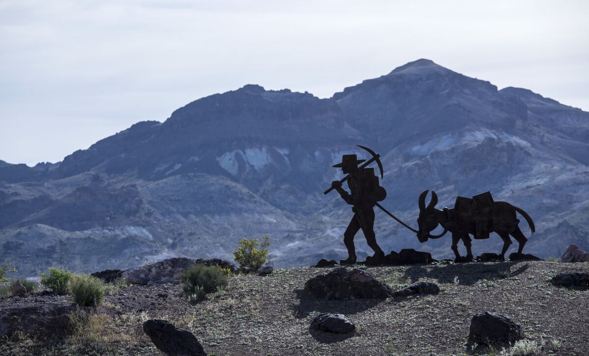 A sculpture of a prospector marks a boundary of Death Valley National Park.