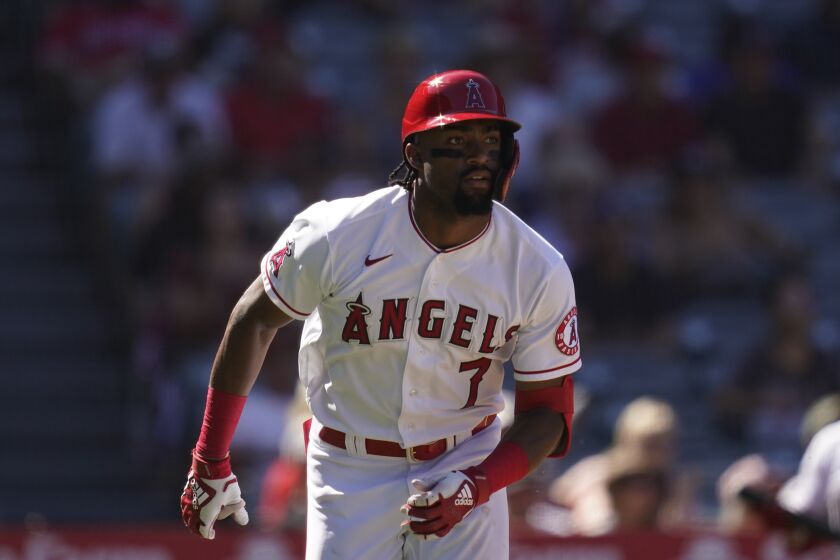 Los Angeles Angels' Jo Adell runs to first base during a baseball game against the Texas Rangers Sunday, Sept. 5, 2021, in Anaheim, Calif. (AP Photo/Ashley Landis)