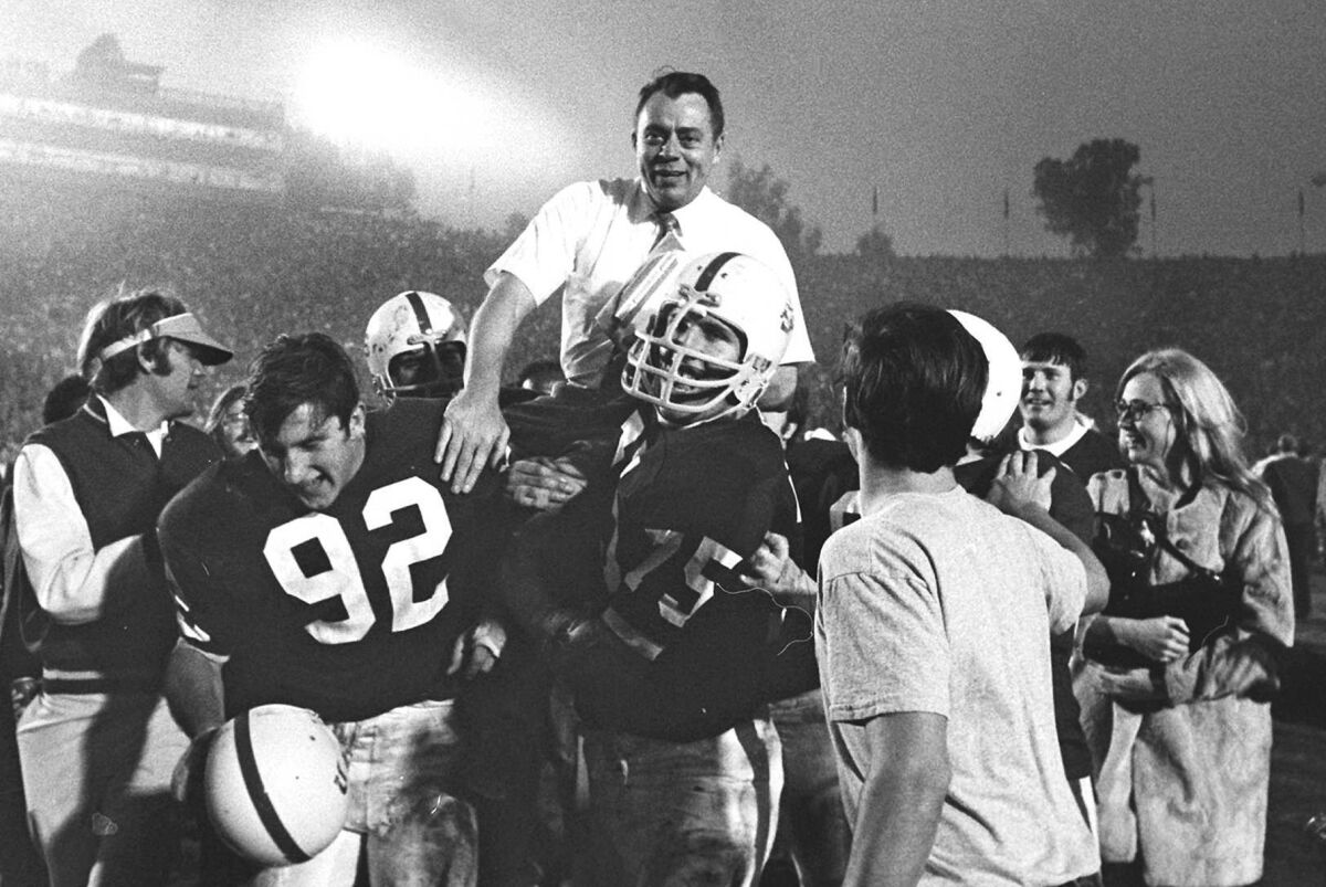 Coach John Ralston carried by Stanford football players