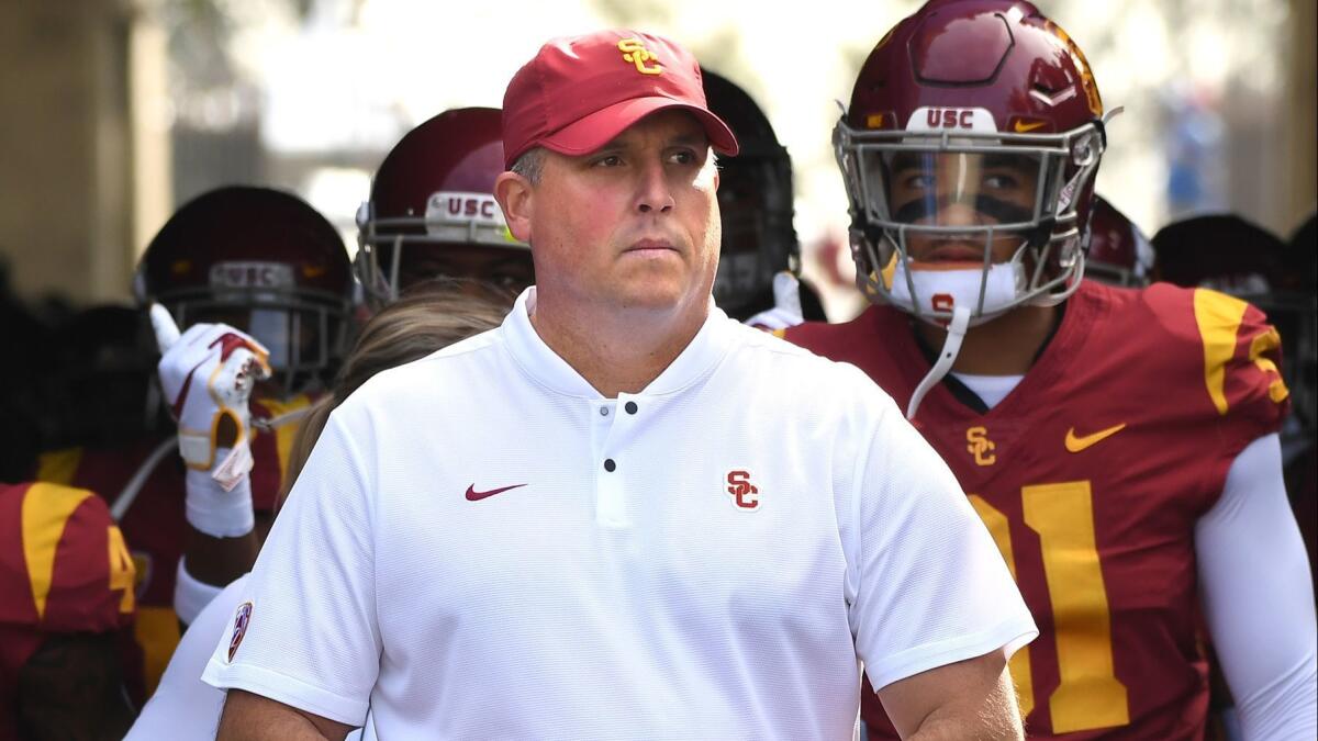 USC head coach Clay Helton leads his team to the field before a game against UCLA at the Rose Bowl on Saturday.