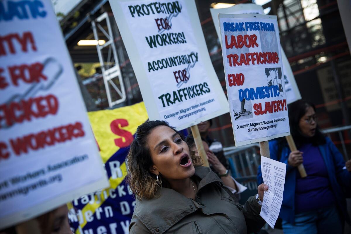 Jessica Penaranda of New York and others protest against labor trafficking and modern-day slavery outside the United Nations in New York on Sept. 23.