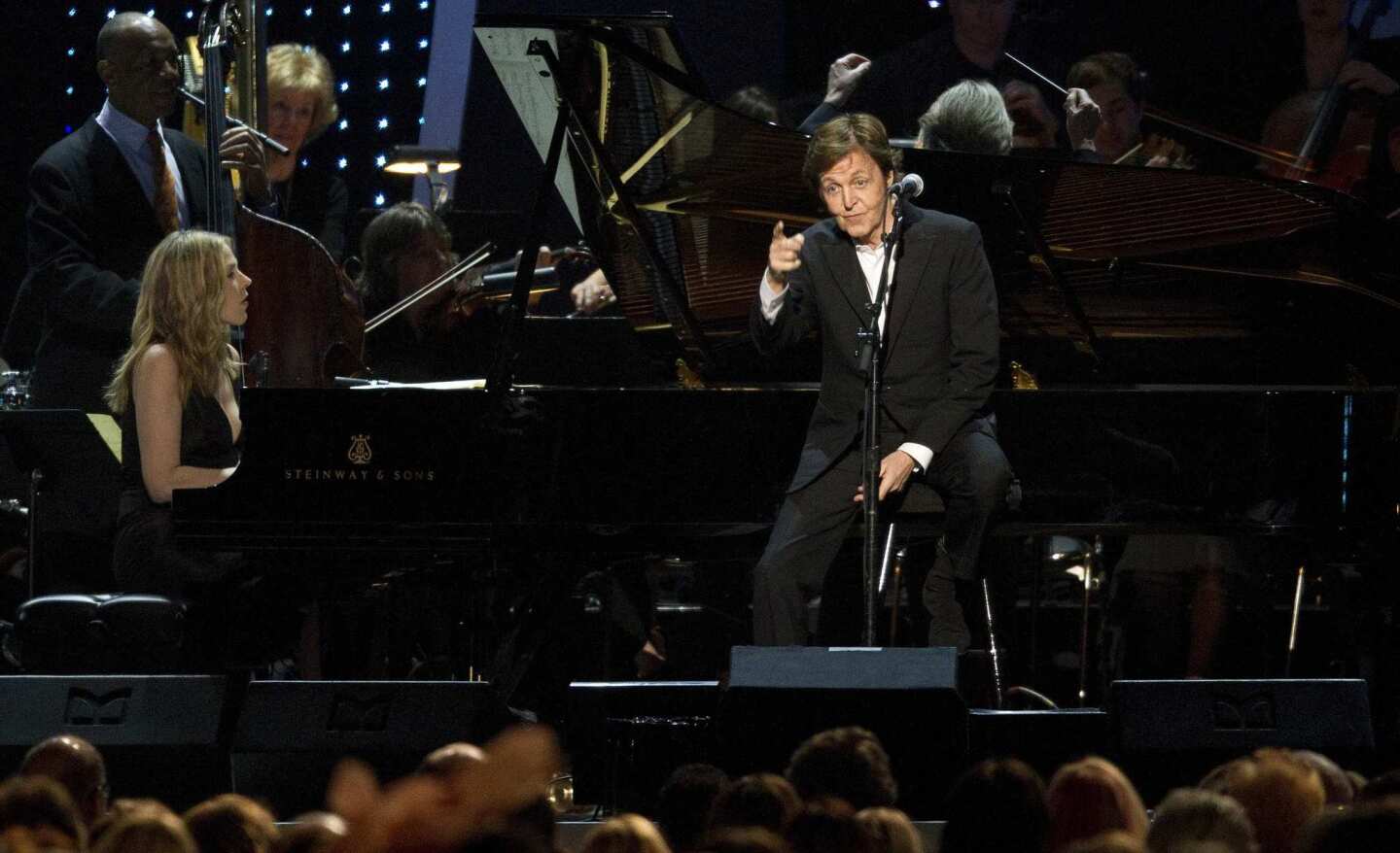 Paul McCartney points to his new wife Nancy in the audience while singing a new ballad, "My Valentine."