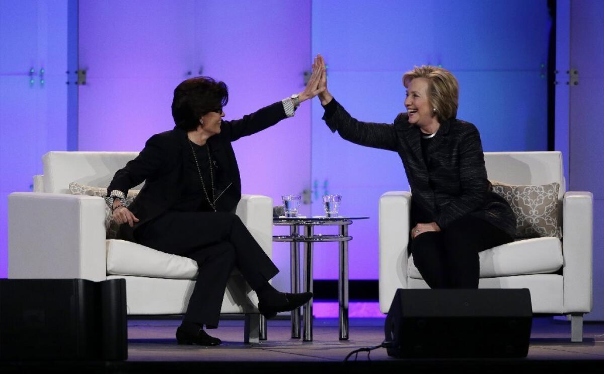 Kara Swisher, left, high-fives Hillary Rodham Clinton during the Watermark Silicon Valley Conference for Women in February. On Tuesday, Vox Media announced that it had acquired Re/Code, the tech business news site cofounded by Swisher and Walt Mossberg.