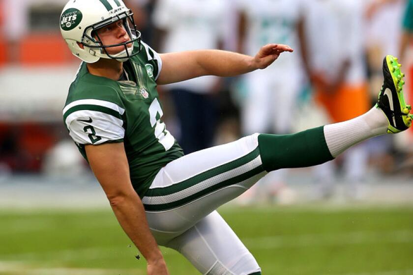 Jets kicker Nick Folk follows through on a field goal against the Dolphins at Sun Life Stadium in Miami Gardens, Fla.