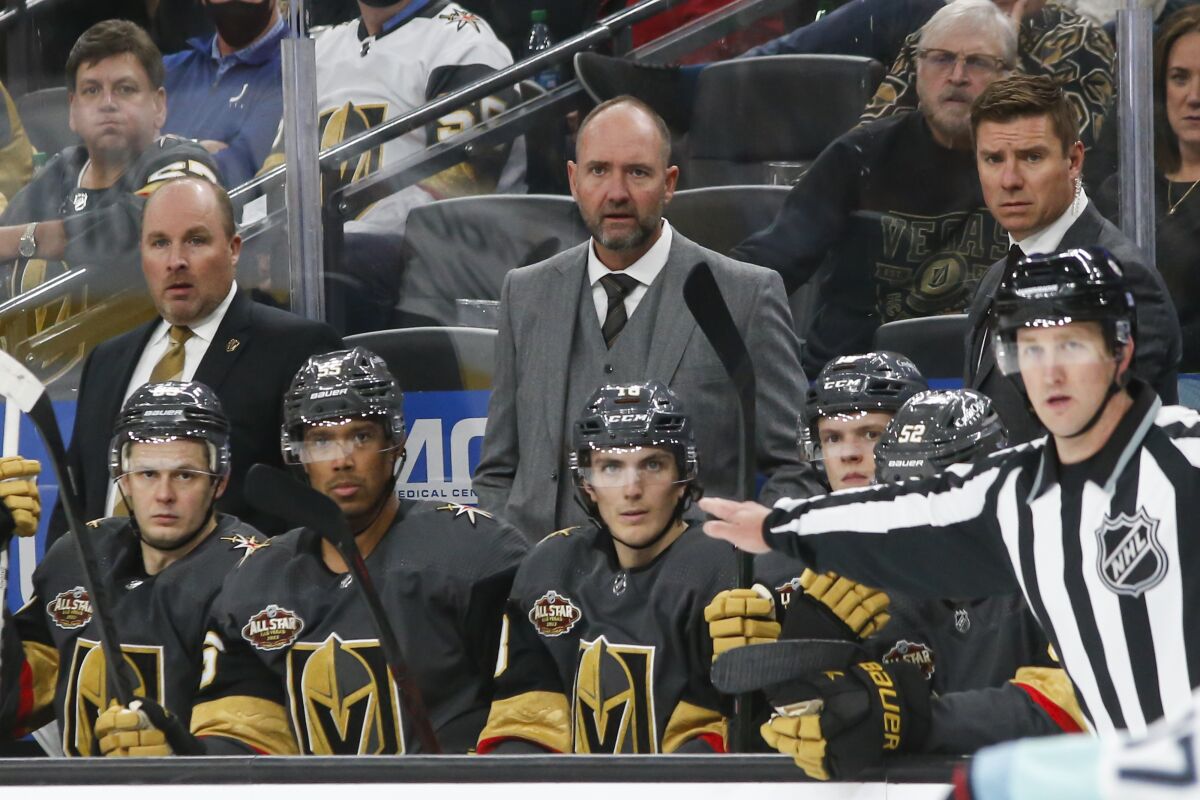 Vegas Golden Knights coach Peter DeBoer watches during the third period of the team's NHL hockey game against the Seattle Kraken on Tuesday, Oct. 12, 2021, in Las Vegas. (AP Photo/Chase Stevens)