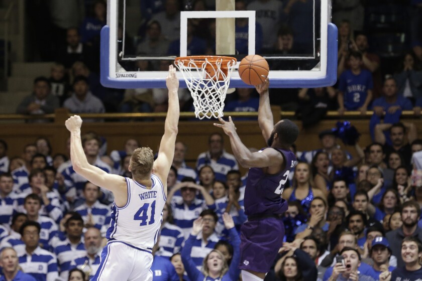 Nathan Bain leaps to make his buzzer-beating layup.
