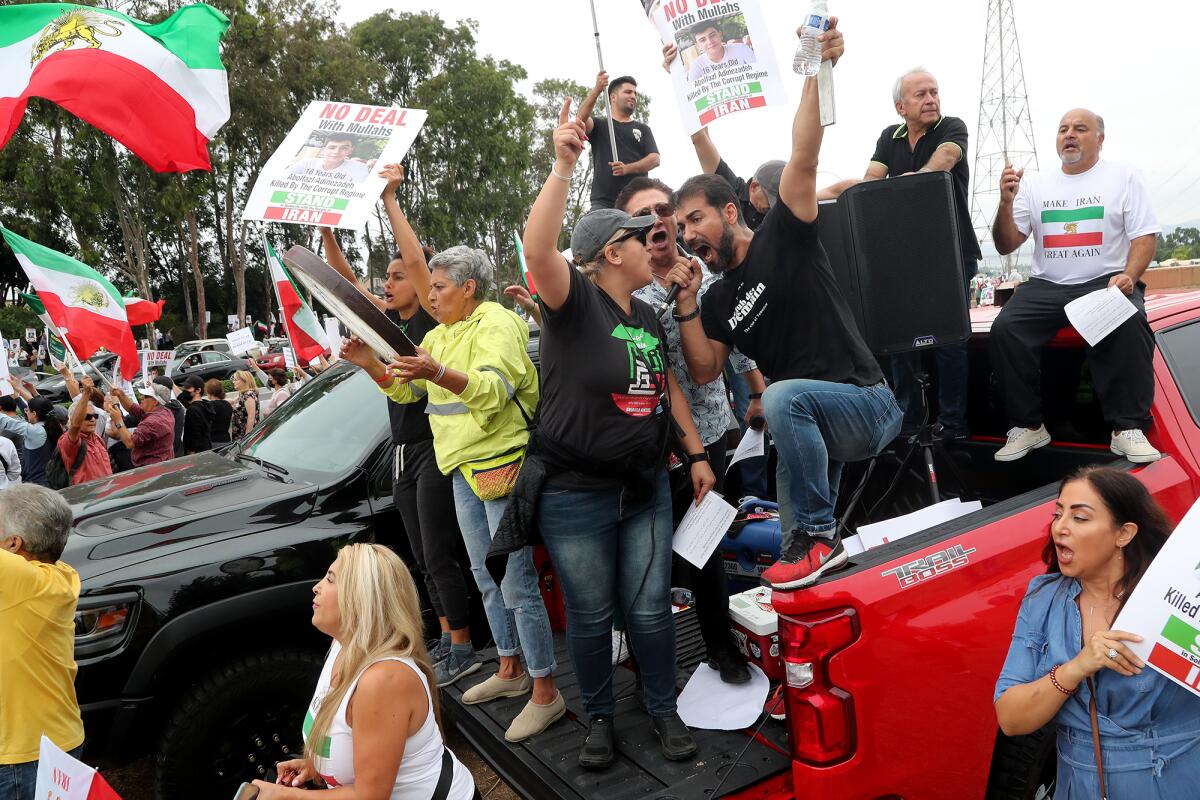 Demonstrators voice their support for a free and democratic Iran during President Joe Biden's visit to Irvine on Friday.