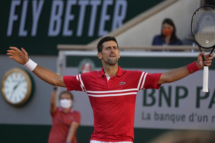 Serbia's Novak Djokovic reacts after winning a point against Stefanos Tsitsipas of Greece during their final match of the French Open tennis tournament at the Roland Garros stadium Sunday, June 13, 2021 in Paris. (AP Photo/Michel Euler)