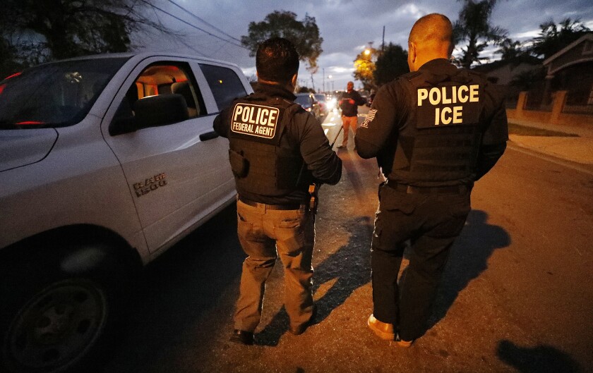 ICE agents seen from behind