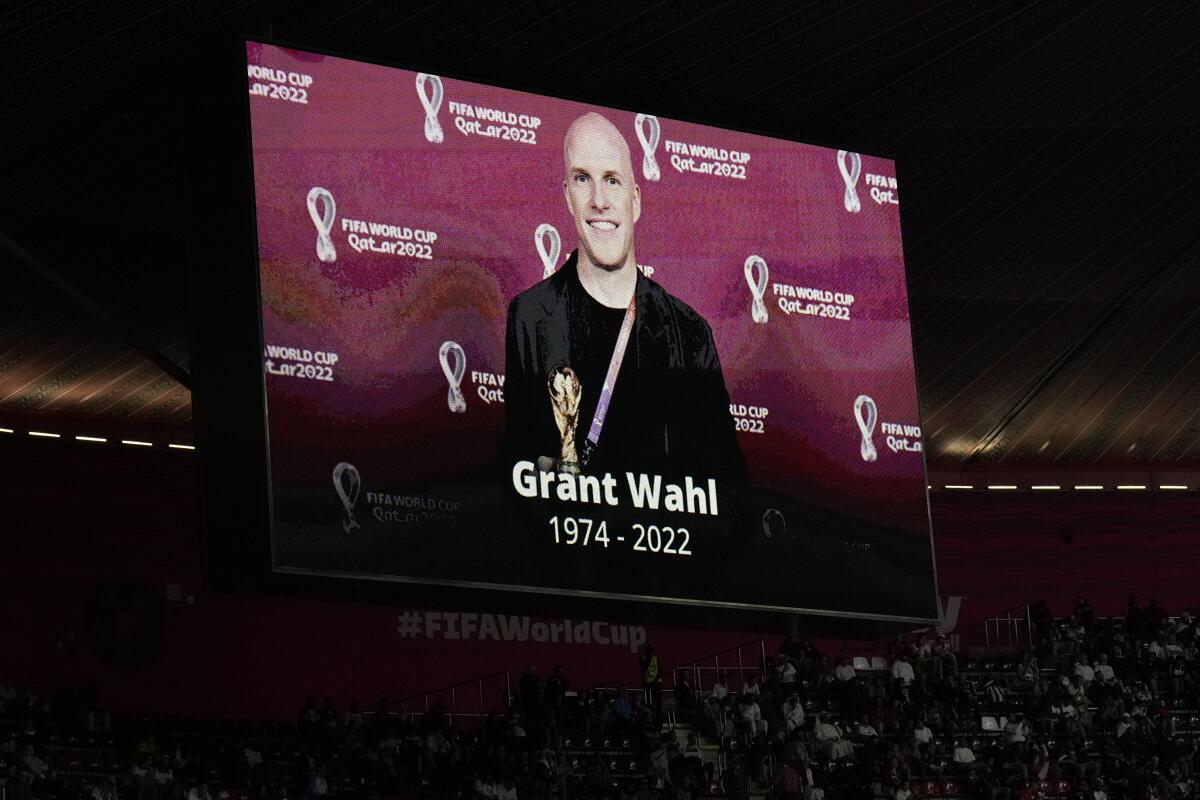 A tribute to journalist Grant Wahl is show on a screen before the World Cup match between England and France.