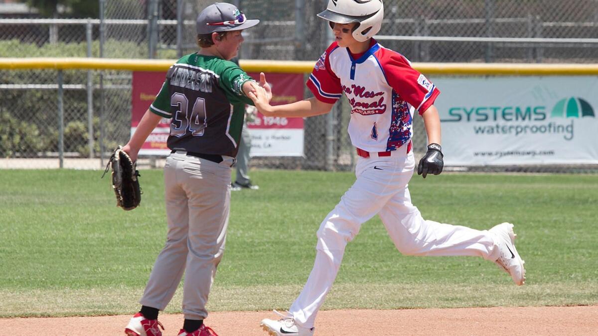 Kaiden Kahkosko of Costa Mesa National rounds the bases after hitting a homer in the annual Mayor's Cup series at Costa Mesa high on Saturday.