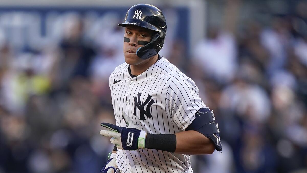 New York Yankees Aaron Judge rounds the bases after hitting a solo home run against the Cleveland Guardians in the playoffs.