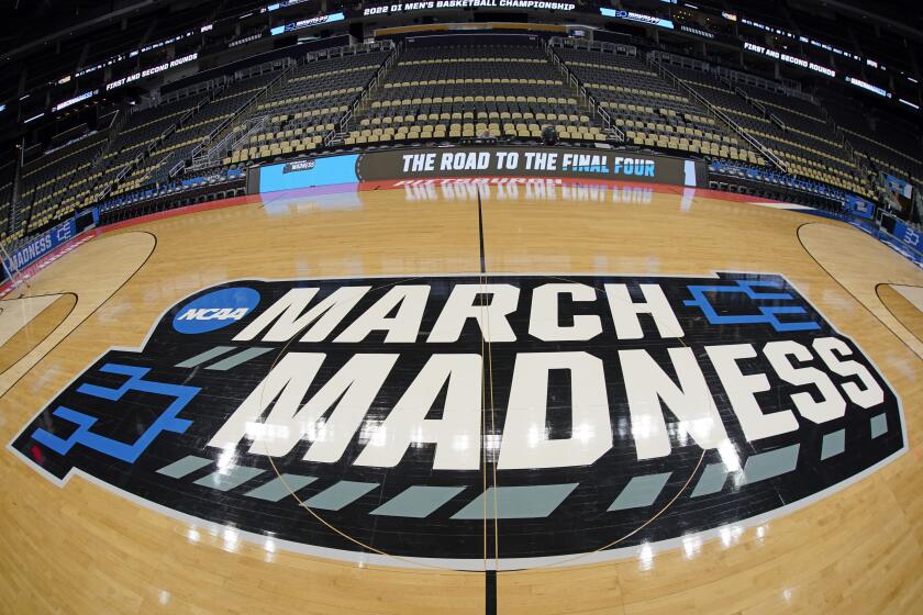 The basketball court at PPG Paints Arena in Pittsburgh is prepared on Thursday, March 17.