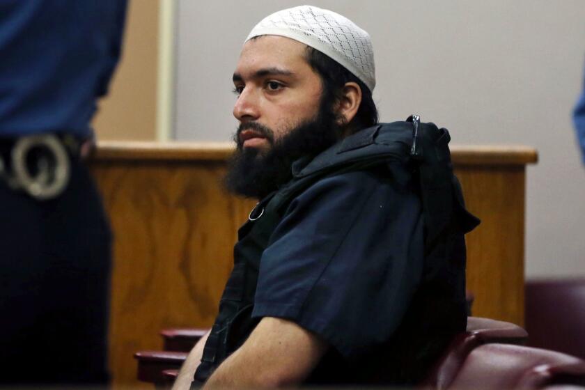 FILE - In this Dec. 20, 2016 file photo, Ahmad Khan Rahimi, the man accused of setting off bombs in New Jersey and New York's Chelsea neighborhood in September, sits in court in Elizabeth, N.J. His trial opens, Monday, Oct. 2, 2017 in New York. (AP Photo/Mel Evans, File)