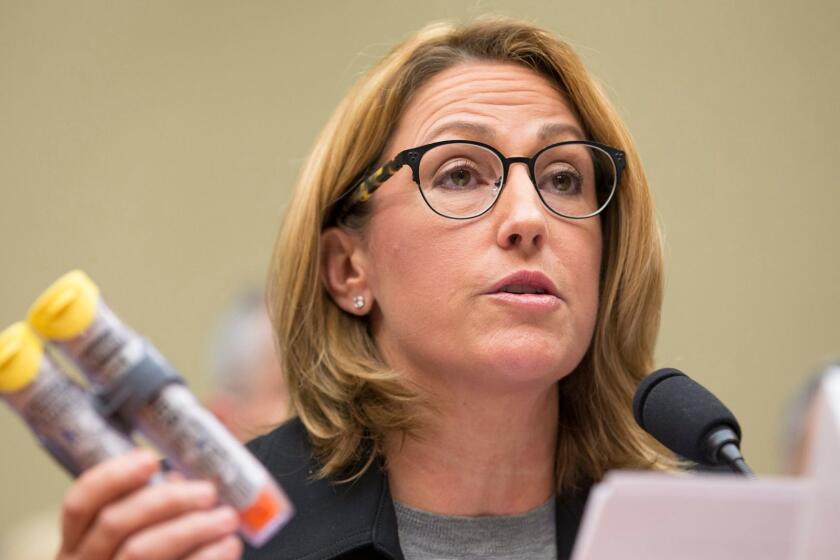 epa05551114 Mylan Inc. CEO Heather Bresch holds up an EpiPens at the House Oversight and Government Reform Committee hearing, 'Reviewing the Rising Price of EpiPens', on Capitol Hill in Washington, DC, USA, 21 September 2016. Mylan has been accused of cornering the market and raising prices beyond a reasonable level. EPA/MICHAEL REYNOLDS ** Usable by LA, CT and MoD ONLY **