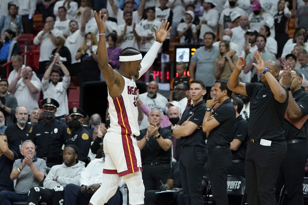 Miami Heat forward Jimmy Butler walks off the court during the second half of Game 2 of an NBA basketball first-round playoff series against the Atlanta Hawks, Tuesday, April 19, 2022, in Miami. The Heat won 115-105. (AP Photo/Lynne Sladky)