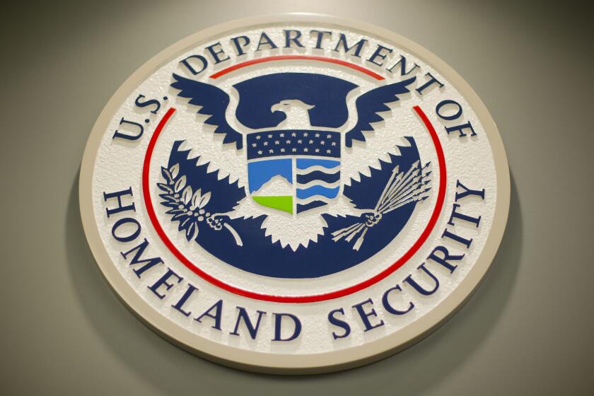 FILE - Homeland Security logo is seen during a joint news conference in Washington, Feb. 25, 2015. The Department of Homeland Security is stepping up an effort to counter disinformation coming from Russia as well as misleading information that human smugglers circulate to target migrants hoping to travel to the U.S.-Mexico border. (AP Photo/Pablo Martinez Monsivais, File)