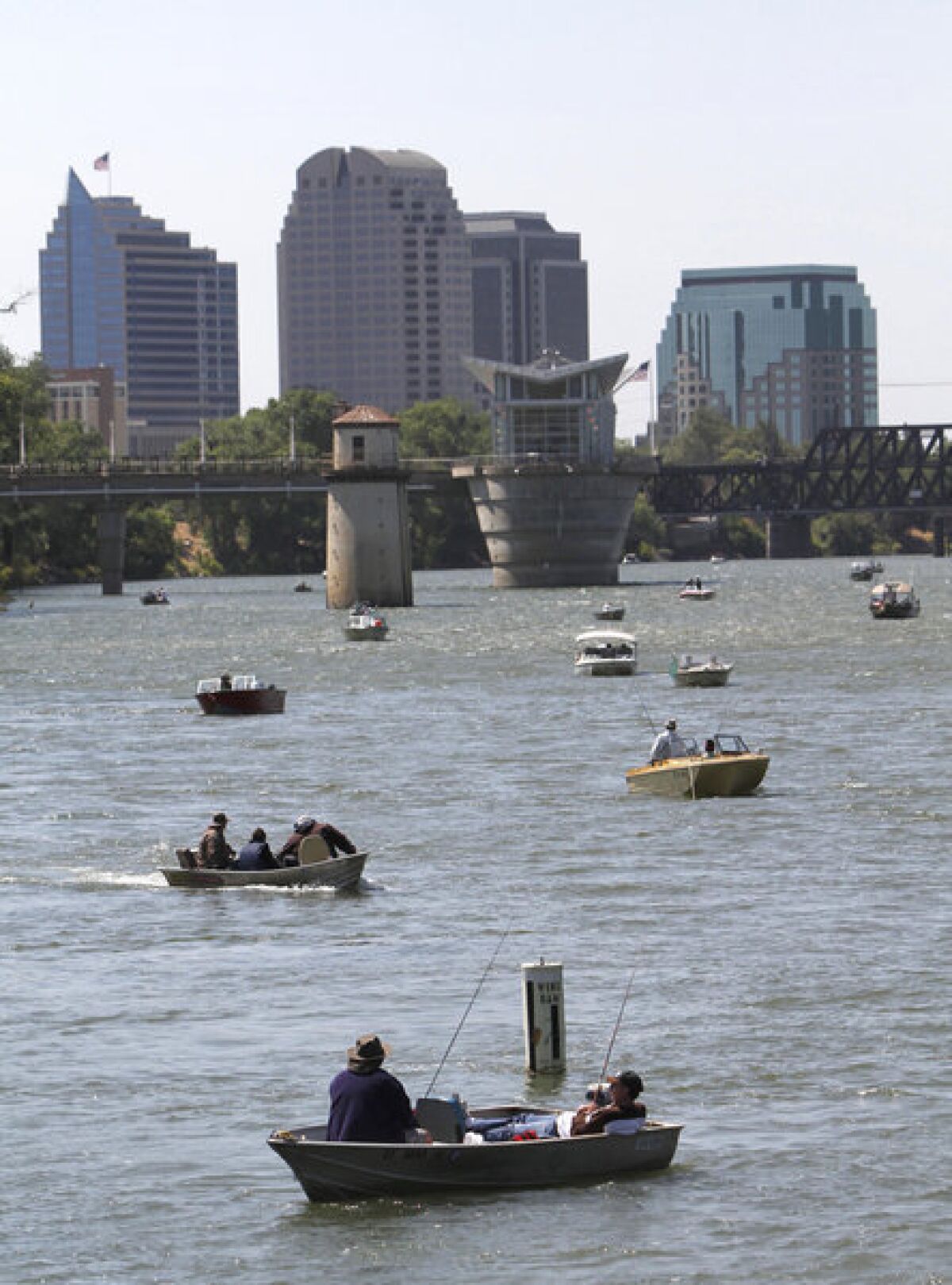 Fishermen on the Sacramento River as it flows past the state capital. The biological health of rivers and streams in the West was found to be better than in the East.