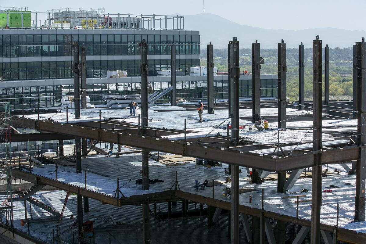 Construction crews work on the UCI Medical Center Irvine-Newport.