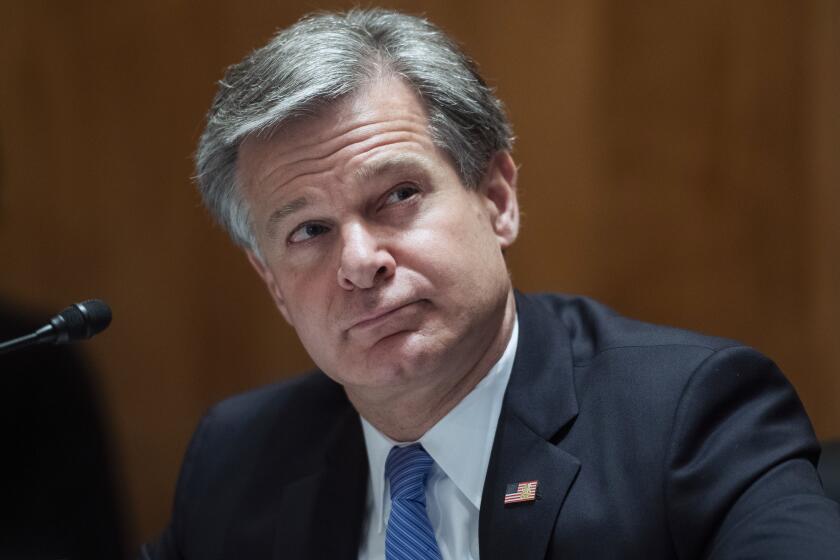 FBI Director Christopher Wray, testifies during a Senate Homeland Security and Governmental Affairs Committee hearing on "Threats to the Homeland" Thursday, Sept. 24, 2020 on Capitol Hill in Washington. (Tom Williams/Pool via AP)
