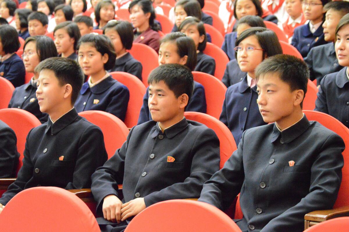 Young people wait for the show to start at North Korea's Children's Palace in Pyongyang.